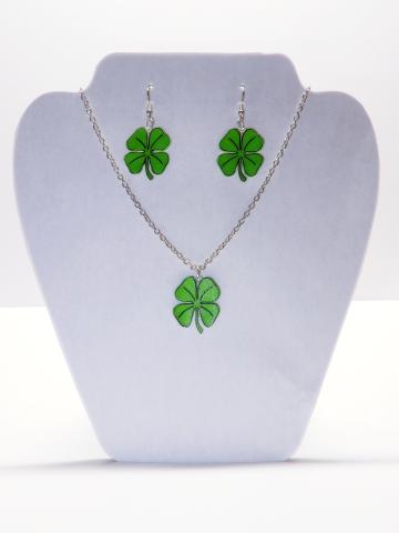 A necklace and pair of earrings with charms in the shape of shamrocks