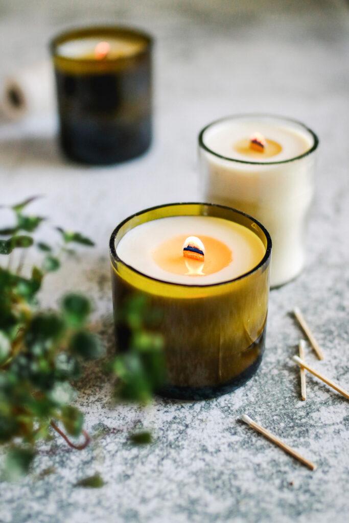 Homemade candles using cut wine bottles