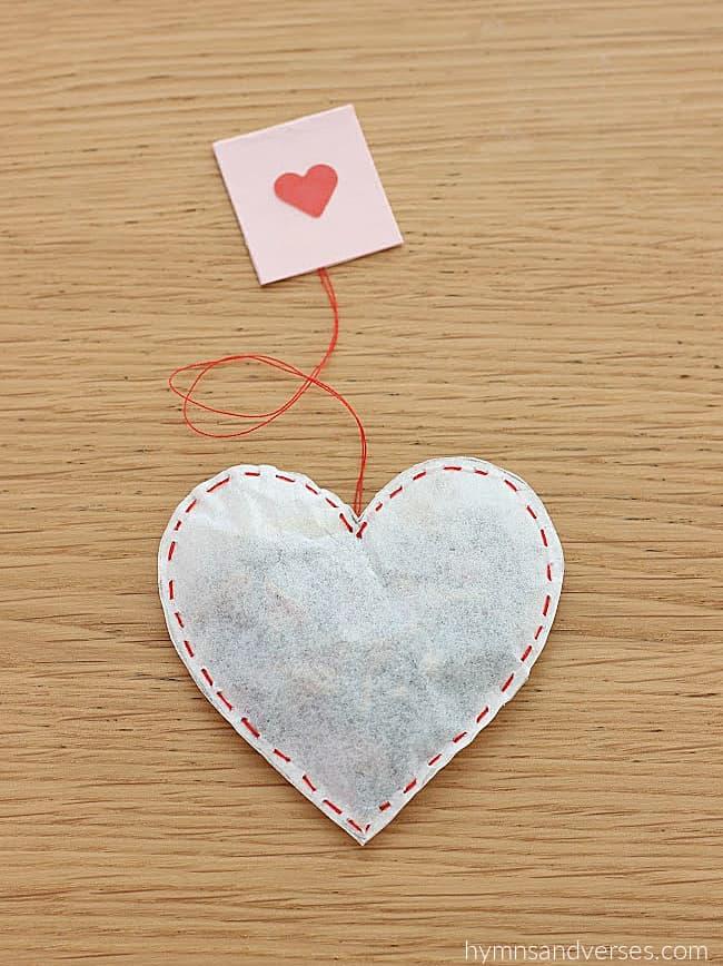 Heart Shaped Tea bag with a tag featuring a small pink heart