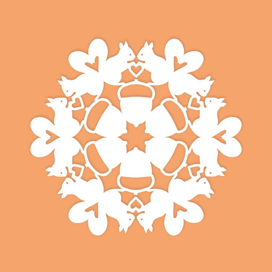 paper snowflake with squirrel pattern